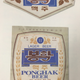 Labels from bottles of Ponghak Beer. The beer is brewed in Pyongsong, a satellite city of Pyongyang. It is acknowledged for being good on tap but does not travel well as the beer is not pasteurized, hence the date marks in months along the top, and in days along the bottom of the label.